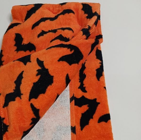 Orange hand towels covered in black bats - Picture 3 of 4
